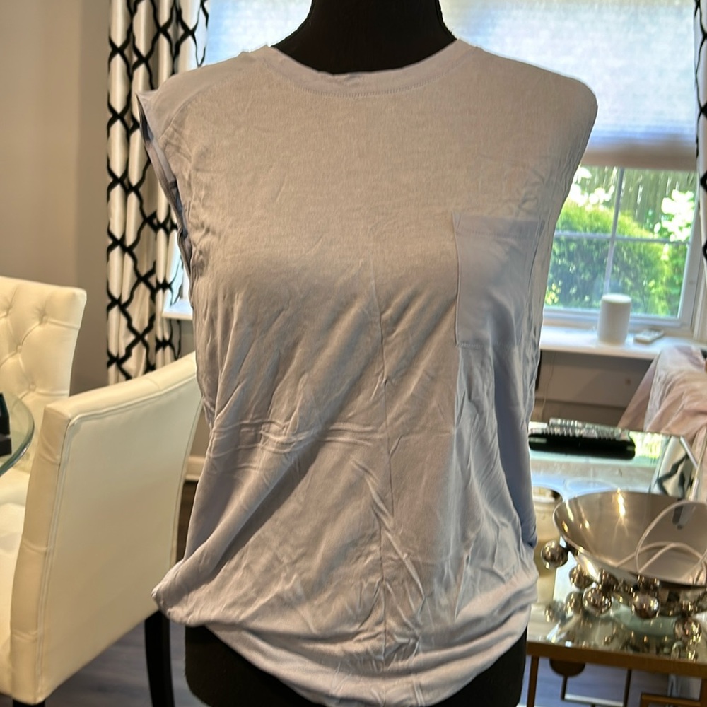Light blue dressy T shirt with pocket size M